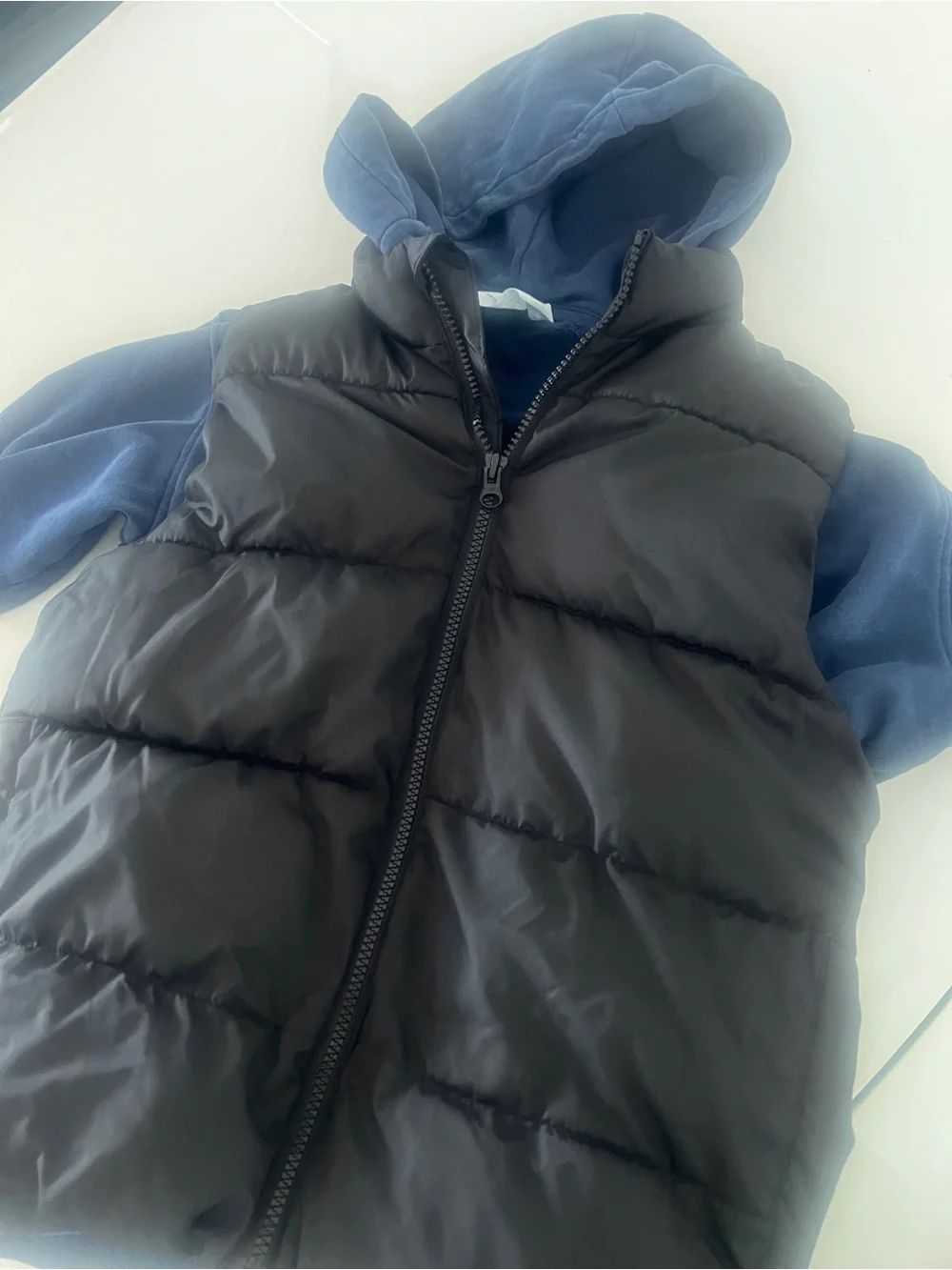 Old Navy Kids Black Puffer Vest with H&M Blue Hoodie together for a Layered Look